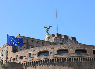 Rome, RM, Italy - August 16, 2020: Monument called Castel Saint Angel with European Flag.and statue...