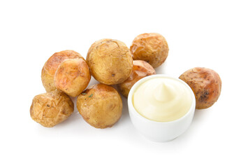 Pile of tasty baked potato with sauce on white background