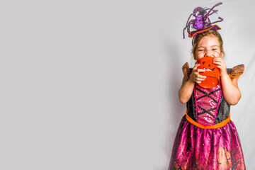 Little cute girl in witch costume for Halloween