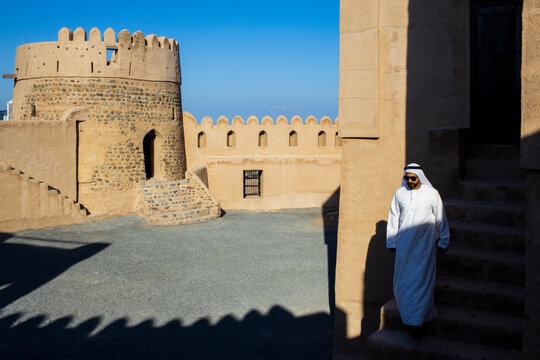 Middle Eastern Arab Emirati man exploring Fujairah Fort in the United Arab Emirates