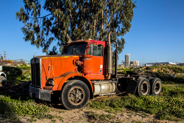Old red truck in the fild 