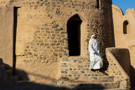 Middle Eastern Arab Emirati man exploring Fujairah Fort in the United Arab Emirates