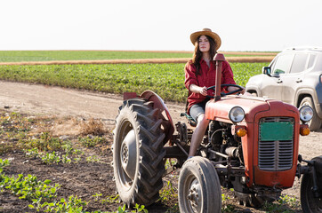 Female farmer driving a tractor © Dusan Kostic