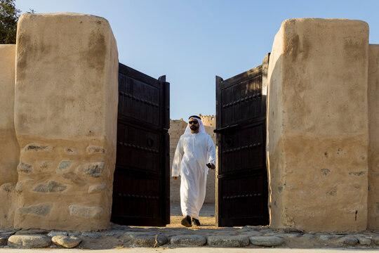 Middle Eastern Arab Emirati man exploring Fujairah Fort in the United Arab Emirates