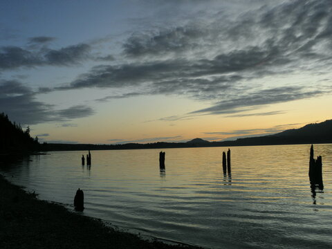sunset over glacial-carved lake quinault, from the shore of lake quinault lodge in olympic national park,  washington