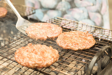 Cooking burgers on the grill. Close-up meat on the grill.