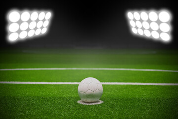 soccer field and the bright lights, Green soccer field, bright spotlights, copy space for text.