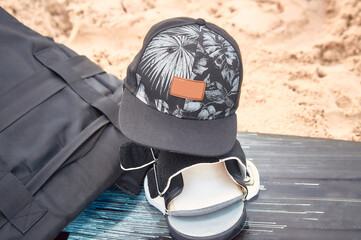 cap backpack and board