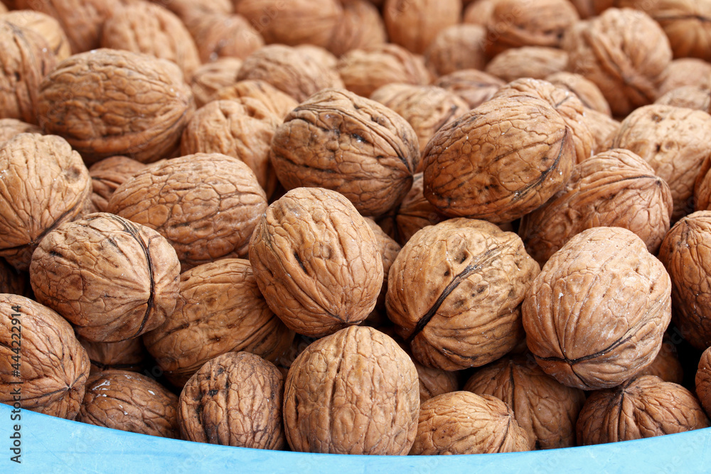 Poster close-up background of organic walnuts