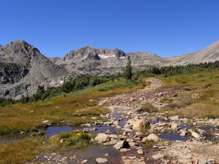 hiking the arapahoe pass trail  with a picturesque mountian back drop up to lake dorothy in the roosevelt national forest in the rocky mountains colorado