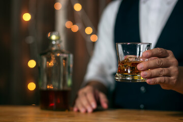 Barman pouring whiskey whiskey glass beautiful night
