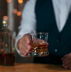 Barman pouring whiskey whiskey glass beautiful night celebrate whiskey on a friendly party in  restaurant