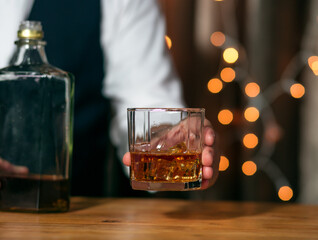 Barman pouring whiskey whiskey glass beautiful night celebrate whiskey on a friendly party in  restaurant