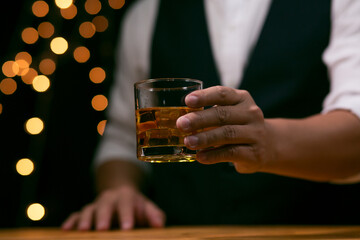 Barman pouring whiskey whiskey glass beautiful night celebrate whiskey on a friendly party in  restaurant