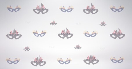 Obraz premium Composition of masquerade masks repeated in rows, on pale grey background