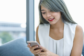 Fashionist woman using smart phone.