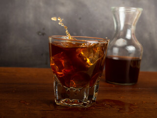 A cup of iced coffee on a wooden table