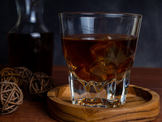 A cup of iced coffee on a wooden table