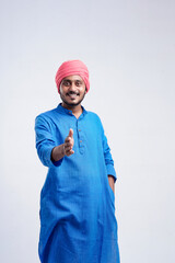 Young indian farmer giving expression on white background