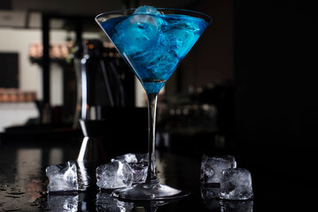 Cocktail on black background. Cocktail at the bar. Alcoholic drink at the night club