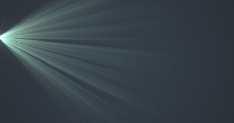 Glowing green rays of light moving against black background