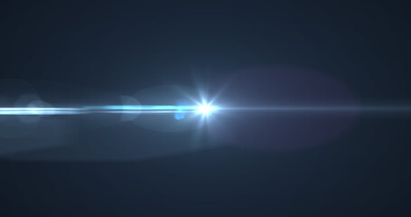 Bright blue spot of light glowing against black background
