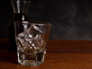 A cup of iced coffee on a wooden table