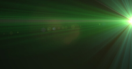 Glowing green rays of light moving against black background
