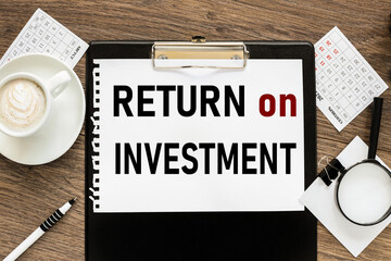 Return on Investment ( ROI ). text on wood table, on white paper