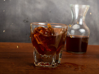 A cup of iced coffee on a wooden table