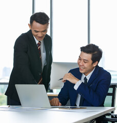 Businessmen working together in office