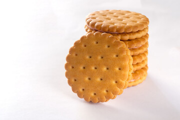 Round biscuit cookies on a white background close up