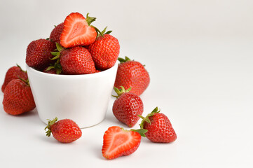 Strawberries on the table and in a plate are white.