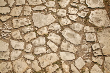 brown stone pavement paved with large cobblestones