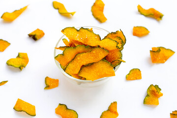 Naklejka premium Green pumpkin slice chips on white background.