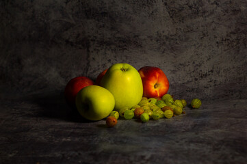 Fototapeta na wymiar Still life with apples, nectarines and gooseberries