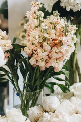 Romantic Wedding Table Top Layout Decor with large lush floral bouquets including white roses, ranunculus, persian buttercups, white orchids and candles