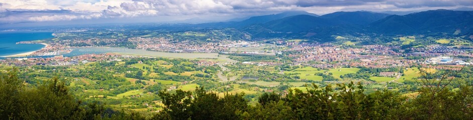 Fototapeta na wymiar Panoramic view of the valley of the mouth of the river Bidasoa and Irun, Euskadi, Spain
