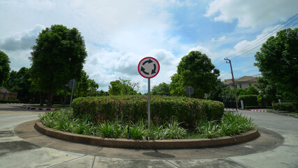 Roundabout road with signs, selective focus