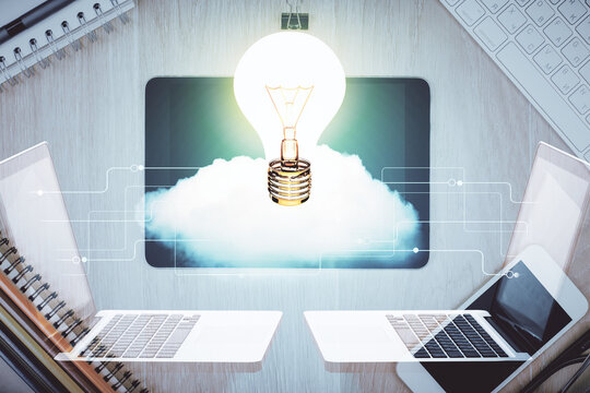 Double exposure of bulb drawing over table with phone. Top view. Concept of idea.