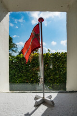 Mors, Denmark A Danish flag in a window nook of a house. © Alexander