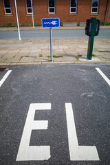 Hirtshals, Denmark July 8, 2021 A parking lot with an electric plug symbol for an electric car.