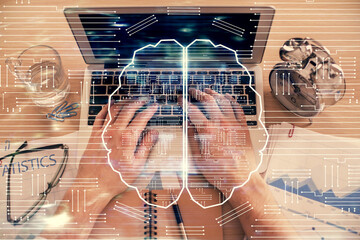 Double exposure of man's hands typing over computer keyboard and brain hologram drawing. Top view....