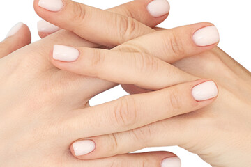Close up clasped hands of woman with maniqured nails isolated on white