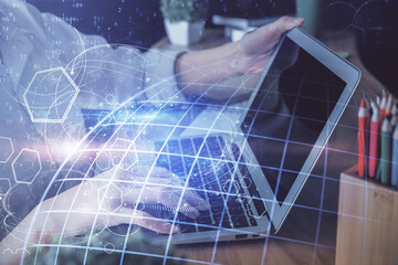 Double exposure of woman hands working on computer and world map hologram drawing. International technology business concept.