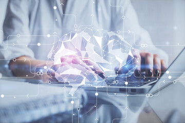 Double exposure of woman hands working on computer and brain hologram drawing. Ai concept.