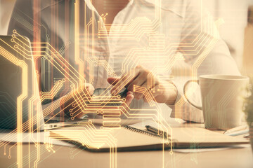 Double exposure of tech icon hologram and woman holding and using a mobile device. Technology concept.