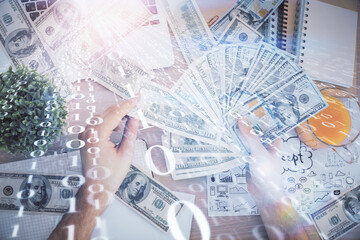 Multi exposure of technology drawing hologram and us dollars bills and man hands. Data concept