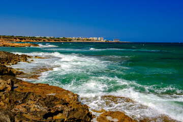Beautiful turquoise sea and the coast of Orihuela Costa in Spain