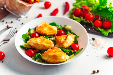 Camembert. Fried camembert cheese with batat fries. Cheese with salad with tomatoes. Fresh food